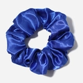 Close-up of premium royal blue satin scrunchie showing smooth fabric texture and elastic pleats - Royal Blue