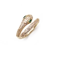 Macro detail of gold snake ring with green zircon eyes and sparkling cubic zirconia stones - Gold Green Eye Snake