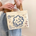 Minimalist beige canvas handbag with blue smiling cloud print and tan straps for women - Sunflower - Cream White