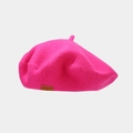 Detail of wool beret in hot pink featuring a brown leather label with LOVE STYLE text - Rose Red
