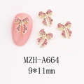 Detail of rose pink rhinestone bow nail art charm with gold base measuring 9x11mm - Balanced Bow (A664)