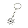 Close-up of a silver nautical ship wheel keychain with a polished metallic finish - Rudder Style