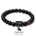 Detail of Capricorn bracelet with black obsidian beads and tiger eye stone inlay - Capricorn