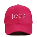 Detailed view of white LOSER and red V embroidery on a dark pink cotton baseball cap - Adjustable / Rose Red