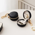 Mini round black PU leather jewelry case with gold zipper and lobster clasp keychain - Black