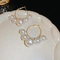 French minimalist gold hoop earrings with gradient pearls on an elegant white ceramic plate - Gold Gradient Pearl