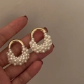 Elegant gold U-shape earrings featuring a classic white pearl on minimalist silver needles - White (Silver Earring Post)