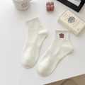 White mid-calf cotton socks with brown bear embroidery and ribbed cuffs - Capybara - Looking Up / 1 Pair