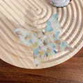 Blue and yellow butterfly hair claw with marble acetate finish on wooden tray - 6.5cm / Dazzling Blue Green