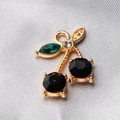 DIY cherry pendant with gold base, black faceted stones and green crystal leaf charm - Style 30
