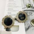 Detail of flower-shaped kids sunglasses with sand color frame and UV400 CE lens protection - Matte Elegant Coffee