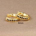 Macro shot of gold hoop earrings with black cubic zirconia and 8mm size marking - 8mm Gold Black Rhinestone (E1014-8mm)