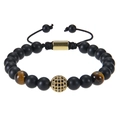 Bracciale intrecciato a mano con pietre nere opache, perle occhio di tigre e sfera d'oro - Stile Occhio di Tigre