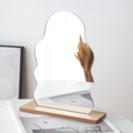 Irregular wave acrylic mirror with natural wooden base for minimalist tabletop decor - Human Shape