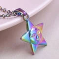 Rainbow plated stainless steel star face pendant necklace on a soft pink plate - Necklace / Rainbow