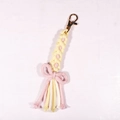 Handmade woven daisy keychain with pink tassels and a gold metal lobster clasp - Light Yellow