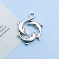 Silver dolphin charm pendant in circular design for ocean-themed jewelry making - 15x20mm / Antique Silver Dolphin