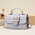 Elegant lilac small square crossbody handbag with gold hardware and top handle design - Gray