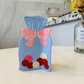 Detail of blue acetate candy-shaped hair claw clip with colorful candy accents - Candy Bag Claw