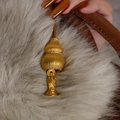 Golden double-gourd pendant with crystal inlay and leather cord on grey fur - 24K Gold Plated Gourd Buddha Style