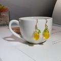 Macro detail of yellow lemon drop earrings with white flower on a ceramic cup - Lemon White Flower Style (FN1003-2)