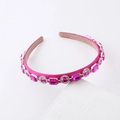 Detail of rose red satin headband with sparkling pink crystals in silver claw settings - Rose Red