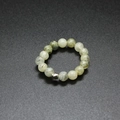 Detail of 4mm grey-green natural stone beads and silver metal bead on an elastic ring - Labradorite
