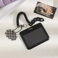 Detail of black ID card holder with coil spring chain and checkered floral pendant charm - Black Horizontal (With Checkerboard Pendant)