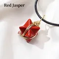 Handcrafted red jasper merkaba star pendant with gold wire wrap on black woven cord - Red Jasper