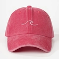 Detailed view of white wave embroidery on the red washed cotton baseball cap texture - Watermelon red