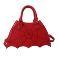 Red bat-shaped saddle bag with black spider web embroidery and golden hardware - Red