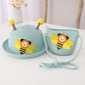 Close-up of mint green woven straw hat and matching crossbody bag with cute bee patches - Hat + Bag Set / Mint Green