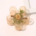 Detailed view of translucent amber flower hair claw clip with metallic spring mechanism - Jelly Flower Hair Clip - Light Orange