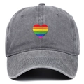 Detailed view of rainbow heart embroidery on dark grey washed denim baseball cap - One Size / Gray