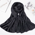 Detailed view of the soft matte satin texture and elegant drape of this solid black hijab - 180*70cm / Black