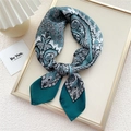 Elegant 70cm paisley silk scarf in dark green and lake blue tied in a stylish knot - Green Candle Flower