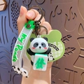 Cartoon panda keychain featuring a green mahjong tile and a my Panda wrist strap - Mahjong 'Fa' Panda
