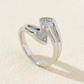 Detail of silver heart-shaped adjustable ring featuring pavé set cubic zirconia stones - Style 8