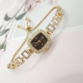 Detailed close-up of gold square watch with crystal accents and adjustable sliding buckle - Gold Color Black