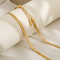 Detail of gold snake bone chain showing the S.STEEL hallmark on the stainless steel clasp - 5mm Width 40cm Length / Gold
