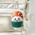 Cute salmon sushi plush keychain with smiling face hanging on a white backpack - Green / 9cm