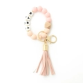 Detail of pink silicone beads, wood accent, and MAMA letter beads with golden clasp - Pink