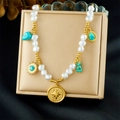 Detail of vintage gold bead chain necklace with pearls, turquoise and sun coin pendant - Turquoise Sun Compass Style (N3739)