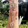 Detail of silver butterfly suncatcher with pink crystal stones and sun-moon charm - Strawberry Quartz