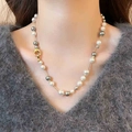Minimalist beaded necklace with white and grey pearls and gold metal accents on a model - Gold (6-10mm Pearl)