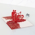 Close-up of laser-cut 3D pop-up wedding card featuring Mr & Mrs heart and red rose patterns - Glitter Red