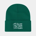 Close-up of white motivational embroidery on cuffed dark green knitted beanie hat - Malachite green