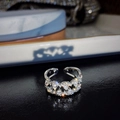 Silver open ring with sparkling transparent gemstones in a minimalist luxury design - Style A Twist