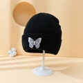 Black knitted beanie hat with white butterfly embroidery and wide fold-over cuff - One Size / Black
