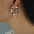 Polished silver U-shaped stainless steel hoop earrings shown on model for women - EH40 U-Shape / Silver